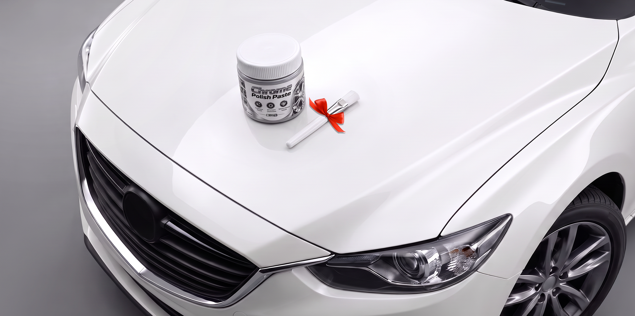 Polishing paste and precision brush on a car hood